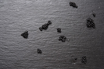 black caviar of paddlefish fish, black background