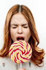 emotional woman with round multicolored lollipop near face enjoyment joy