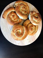 Sliced burek with meat on the wooden board. Rustic food.
