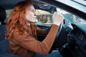 Fototapeta na wymiar Angry and rude woman yelling at the wheel in traffic