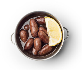 Lebanese starters of Makanek meat marinated, sausages fried in a metal pan isolated on white, clipping path included.