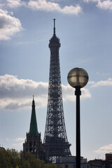 The silhouette of the Eiffel Tower against the blue sky in Paris - 417604046