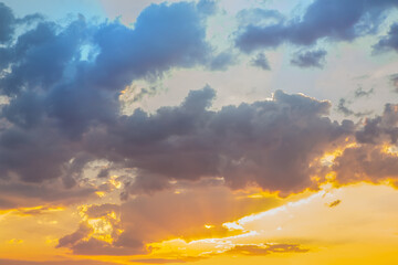 bright sunset in cloudy sky