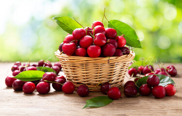 fresh cherries in a basket on a wooden table