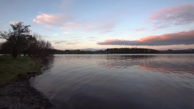 Calm lake in blessington ireland sunset hour golden hour
