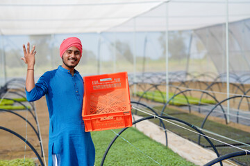 Indian farmer working at green house