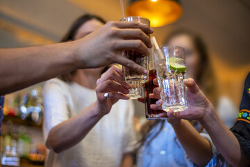 Group of happy friends drinking beer at brewery bar restaurant - Friendship concept with young people having fun together at cool places - Focus on glasses