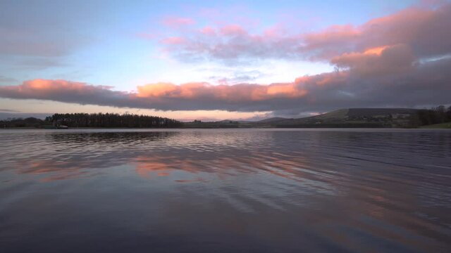Calm lake in blessington ireland sunset hour golden hour