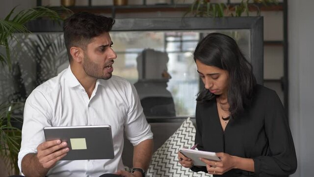 A frustrated/ angry/ dominating male boss shouting at female employee.A furious demanding manager is annoyed as woman colleague messed up the work.Male boss reprimanding incompetent intern.