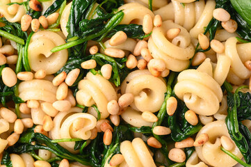 Funghetti pasta with spinach, pine nuts and parmesan.