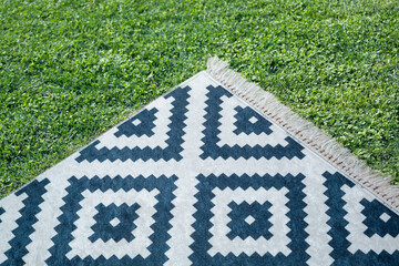 picnic mat standing on grass background