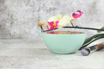 Bowl with chocolate to apply on the skin. Spa, care and health. Copy space.