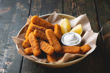 Fish sticks with sauce on the table