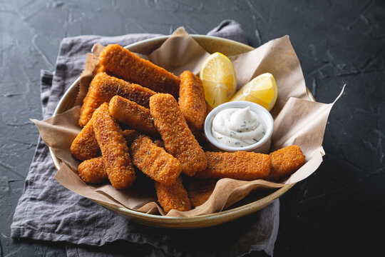 Fish sticks with sauce on the table