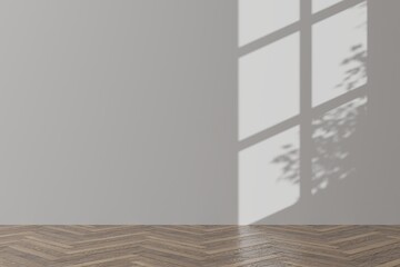 Empty white wall and wooden floor room with shadow from a window and a tree.