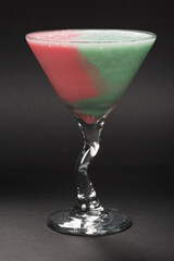 two-tone cocktail of pink and menthol based on ice cream with the addition of strong alcohol