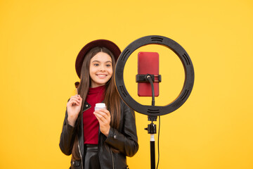 happy teen girl use selfie led. kid beauty blogger. childhood happiness. cheerful child do makeup.