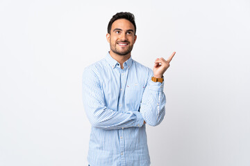 Young handsome man over isolated background pointing up a great idea