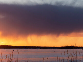cloud color above and below during sunset with sea ice