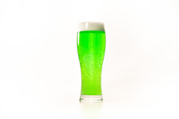 A pint of green beer for st patrick's day on a white background. Traditional Irish drink for a holiday. Copy space