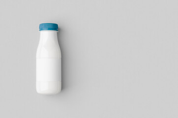 White plastic yogurt or milk bottle mockup with copyspace.