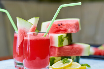 Super delicious and sweet watermelon juice on the glass. Fresh summer fruits background. Sweet watermelon slices. Watermelon fruit