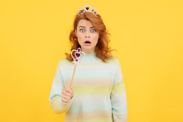 surprised redhead woman in queen crown with magic wand, surprise