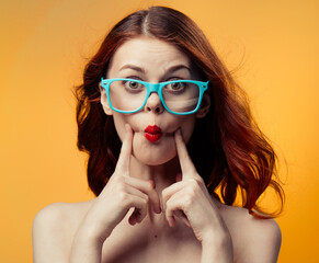 pretty woman naked shoulders red lips glasses luxury yellow background