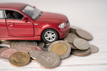 Car with coins, Car loan, Finance, saving money, insurance and leasing time concepts.