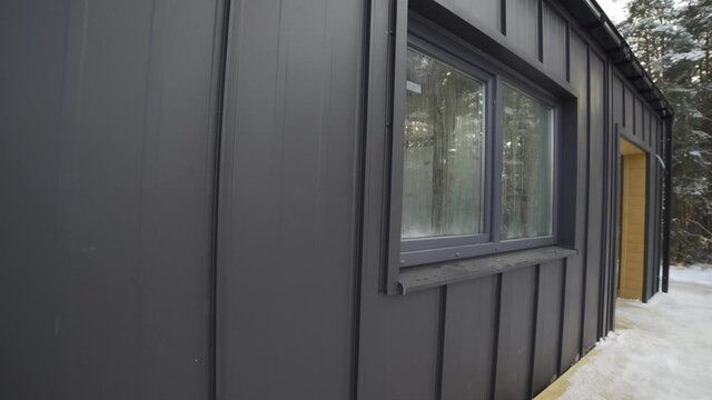 exterior of a frame house under construction.