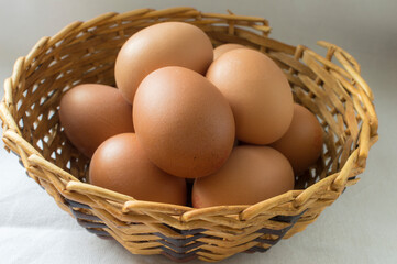 A group of eggs in a wicker basket