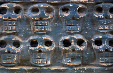 Carved wood human skull decoration stock images. Hand carved wooden human skeleton close-up stock photo. Handcrafted carved skeleton detail images