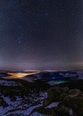 Fototapeta na wymiar night snowy valley with fog and stars