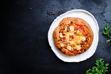 pizza flatbread fast food cheese, tomato sauce, tomato on thick dough on the table meal snack top view copy space food background rustic