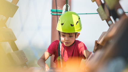 Active boy in climbering park