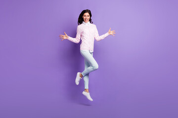 Full length body size view of lovely cheerful content wavy-haired girl jumping having fun isolated on violet color background