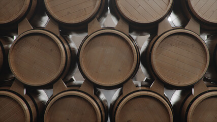 Barrels of wine, whiskey, bourbon liqueur or cognac in the basement. Aging of alcohol in oak barrels in warehouse. Wine, beer, whiskey casks stacked in a cellar, 3D illustration