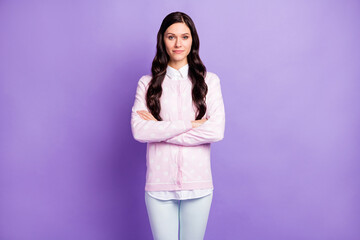 Portrait of pretty content wavy-haired girl wearing casual clothes folded arms isolated on violet color background