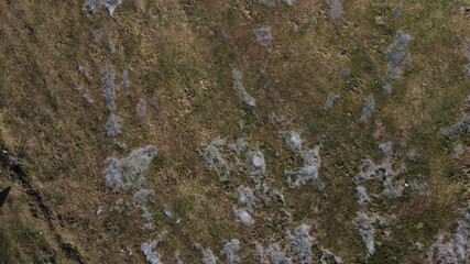 Patches of ice on field.