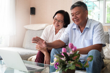 Grandpa and Grandma were a video call on laptop to say hello.