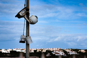 Broken old abandoned surveillance cameras. Rust eaten damaged CCTV Security cams
