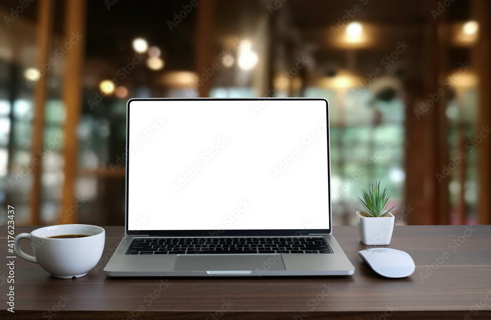 Aufkleber front view of open laptop computer notebook with blank monitor white screen display on work table de