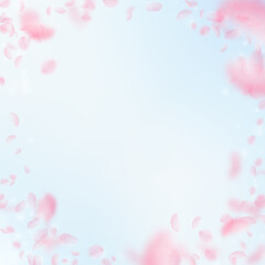 Sakura petals falling down. Romantic pink flowers vignette. Flying petals on blue sky square backgro