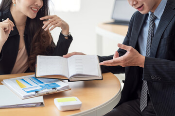 Close-up of a business people analyzing working at the office.