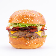 Hamburger with beef cutlets, cheese and bacon on a white background.