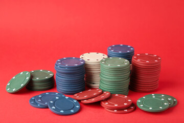 Poker chips on a red background. Casino