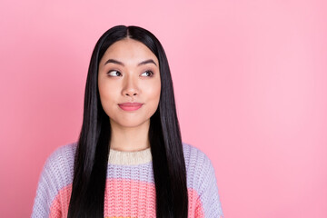 Photo of young beautiful stunning positive smiling asian girl look copyspace dreaming isolated on pink color background