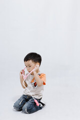 boy eats lollipops on white background
