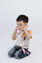 boy eats lollipops on white background