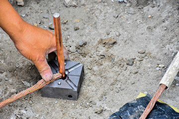 Workers working on protective earth system, used in construction of tall buildings.